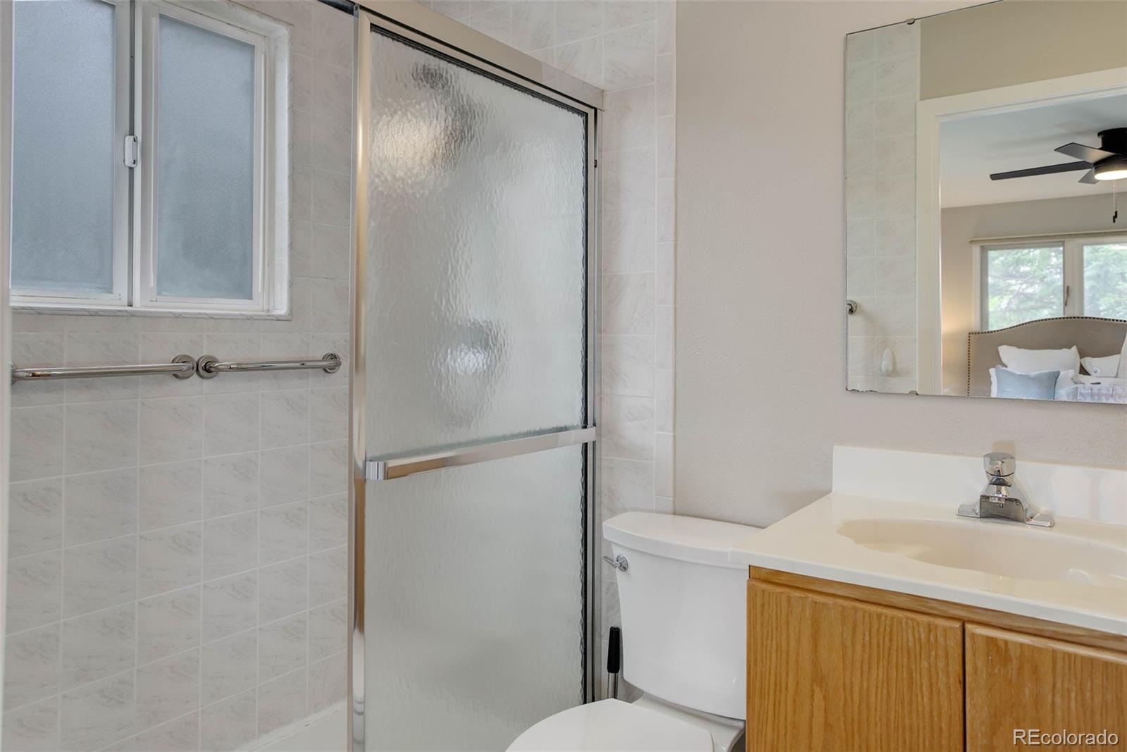 14650 Tejon Street Broomfield, CO 80023 - Photo 22 of 39 a bathroom with a sink toilet and vanity