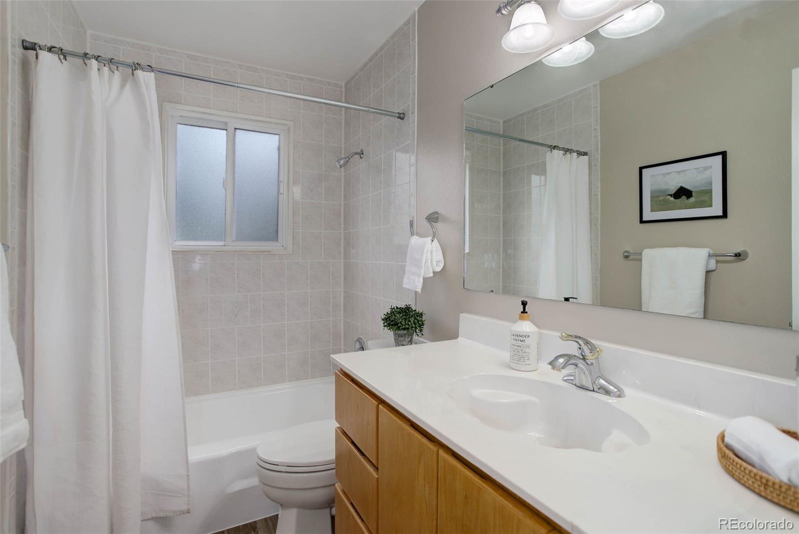 14650 Tejon Street Broomfield, CO 80023 - Photo 25 of 39 a bathroom with a sink toilet and shower