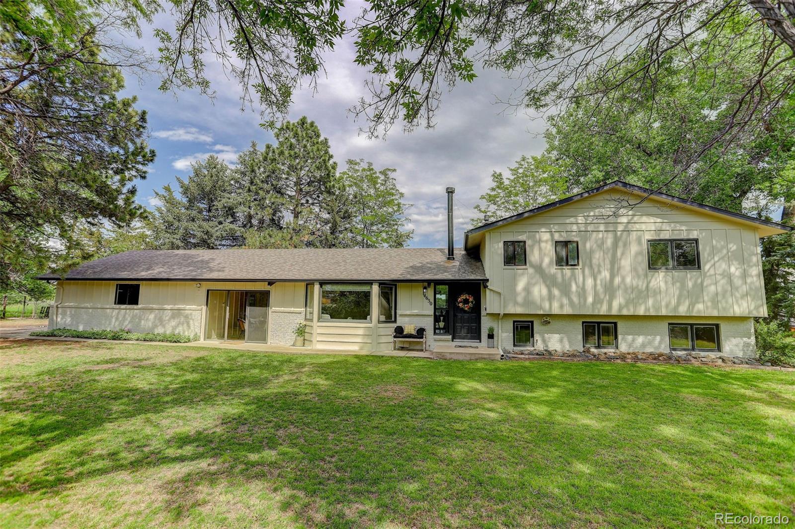 14650 Tejon Street Broomfield, CO 80023 - Photo 3 of 39 a view of house with a yard