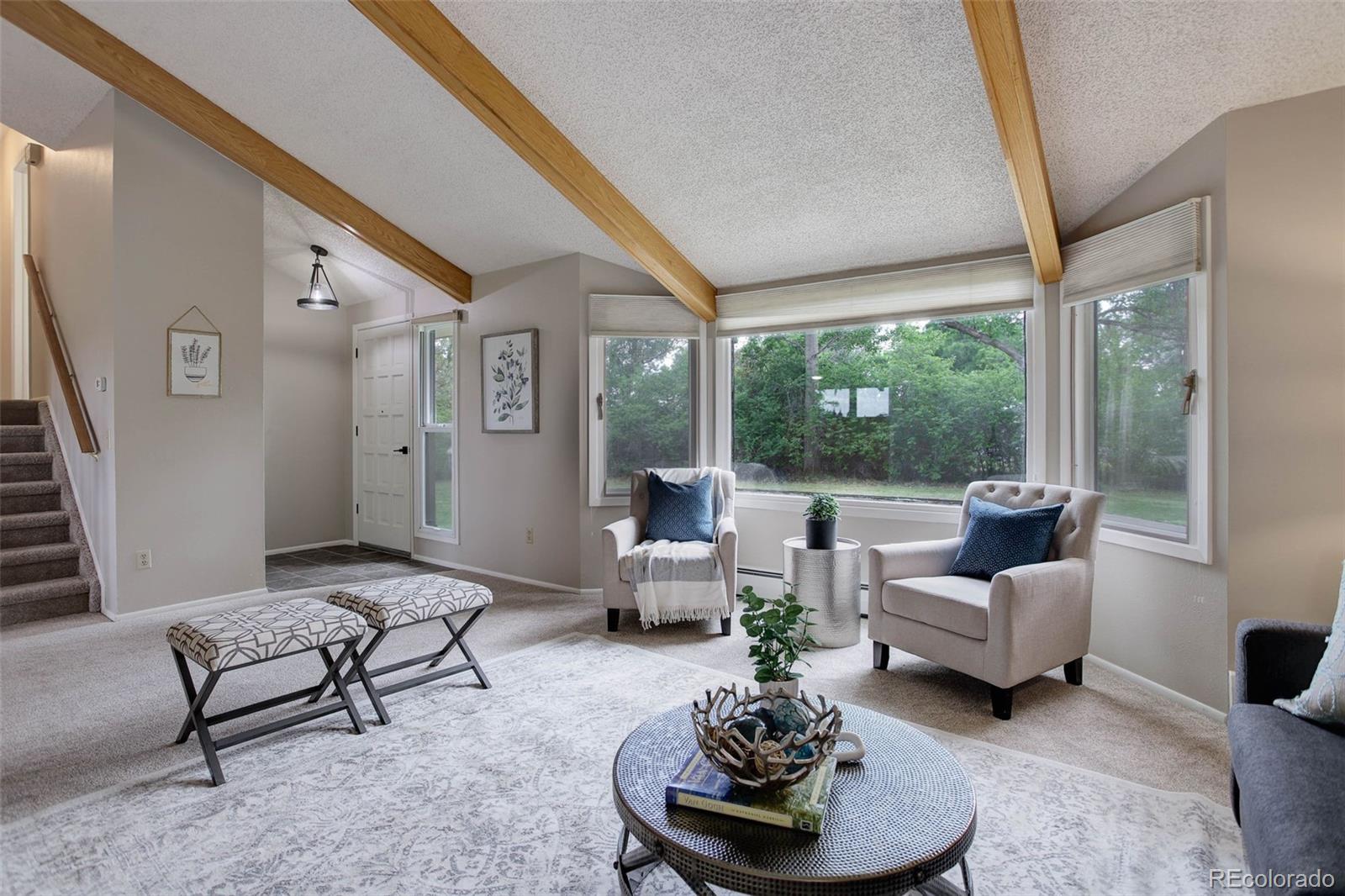 14650 Tejon Street Broomfield, CO 80023 - Photo 8 of 39 a living room with furniture and a large window
