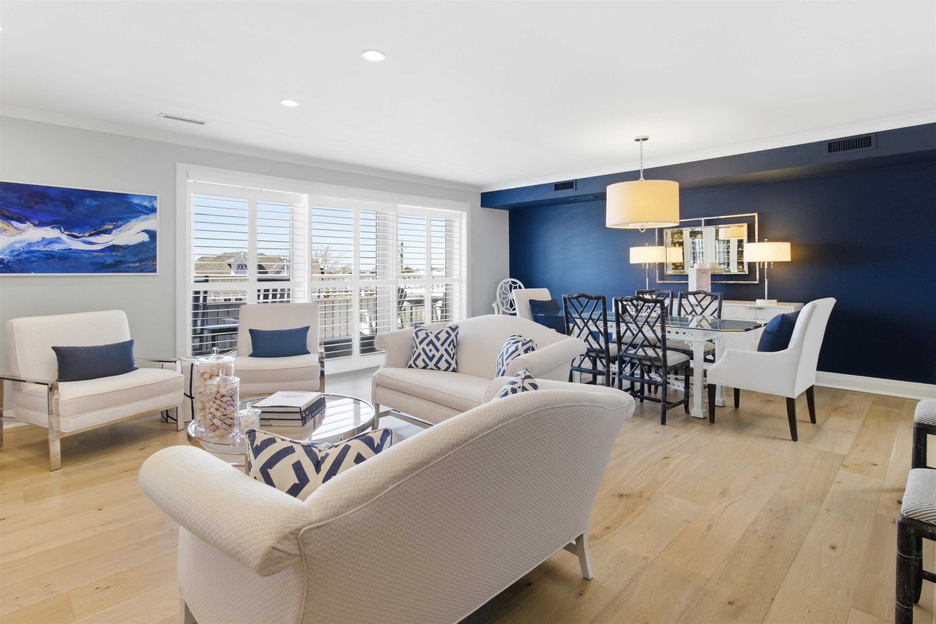 10803 3rd, Unit 6 Stone Harbor, NJ 08247 - Photo 11 of 25 a living room with furniture and a large window