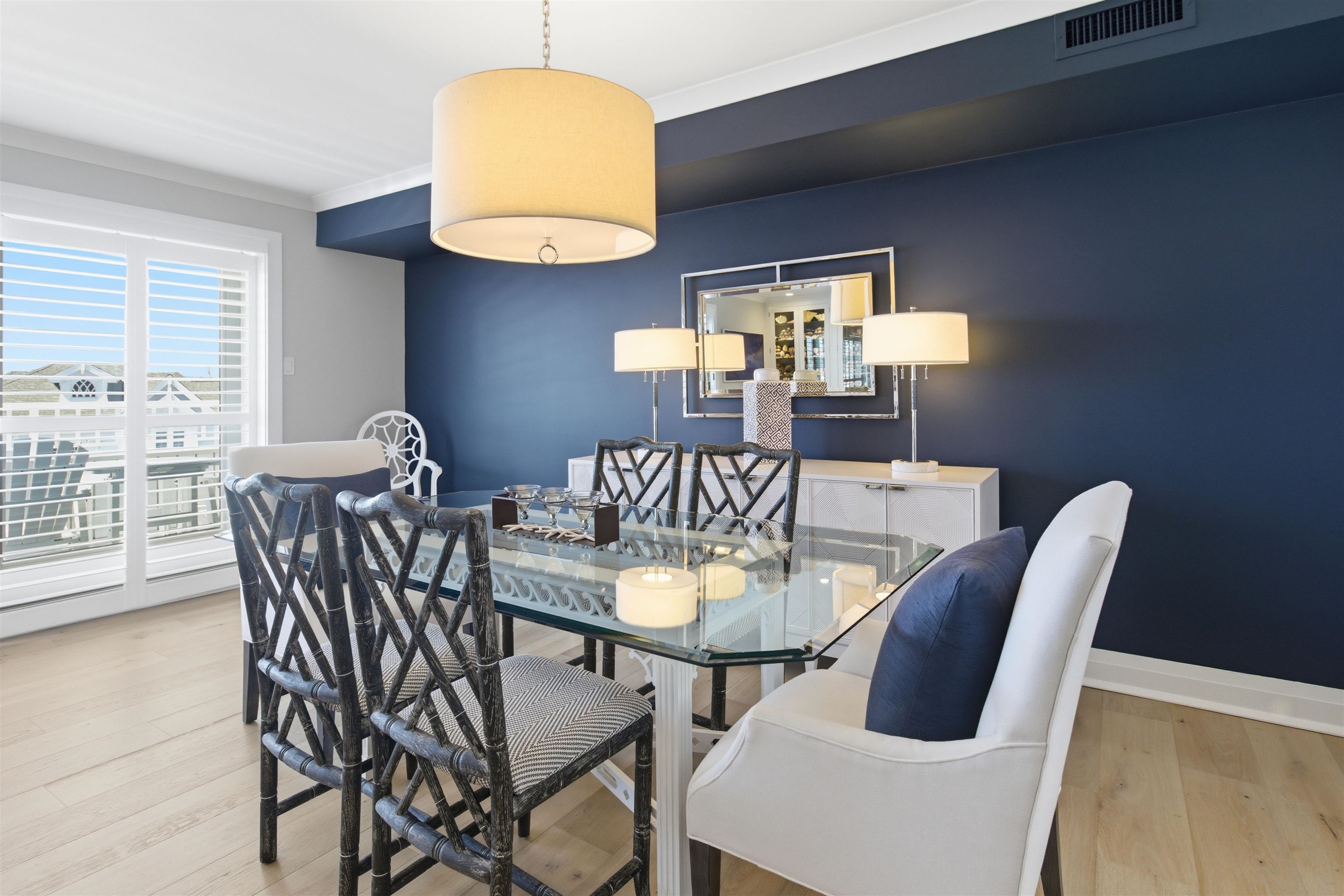 10803 3rd, Unit 6 Stone Harbor, NJ 08247 - Photo 13 of 25 a dining room with furniture and wooden floor