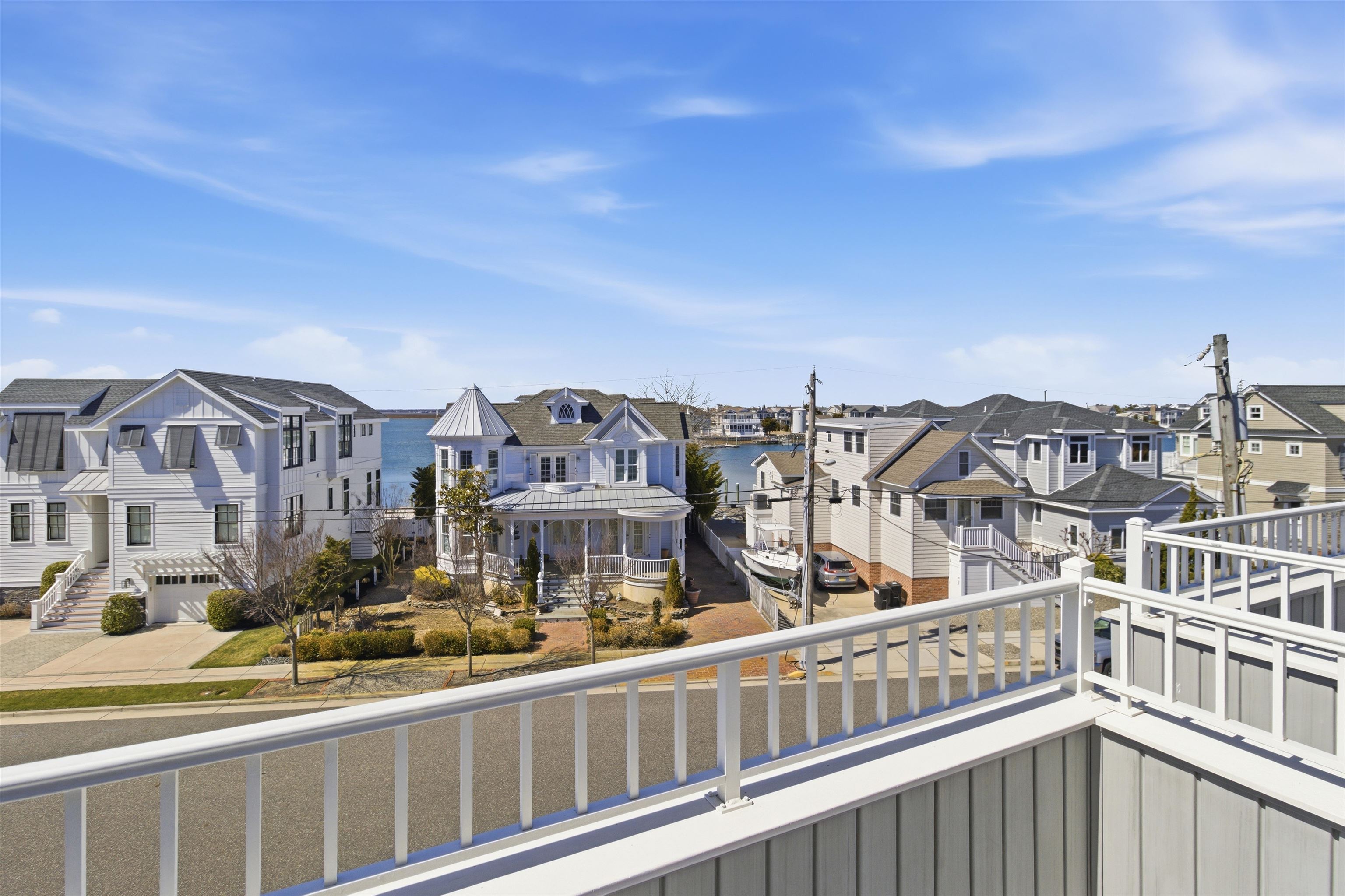 10803 3rd, Unit 6 Stone Harbor, NJ 08247 - Photo 18 of 25 a view of a large building with a street from a balcony