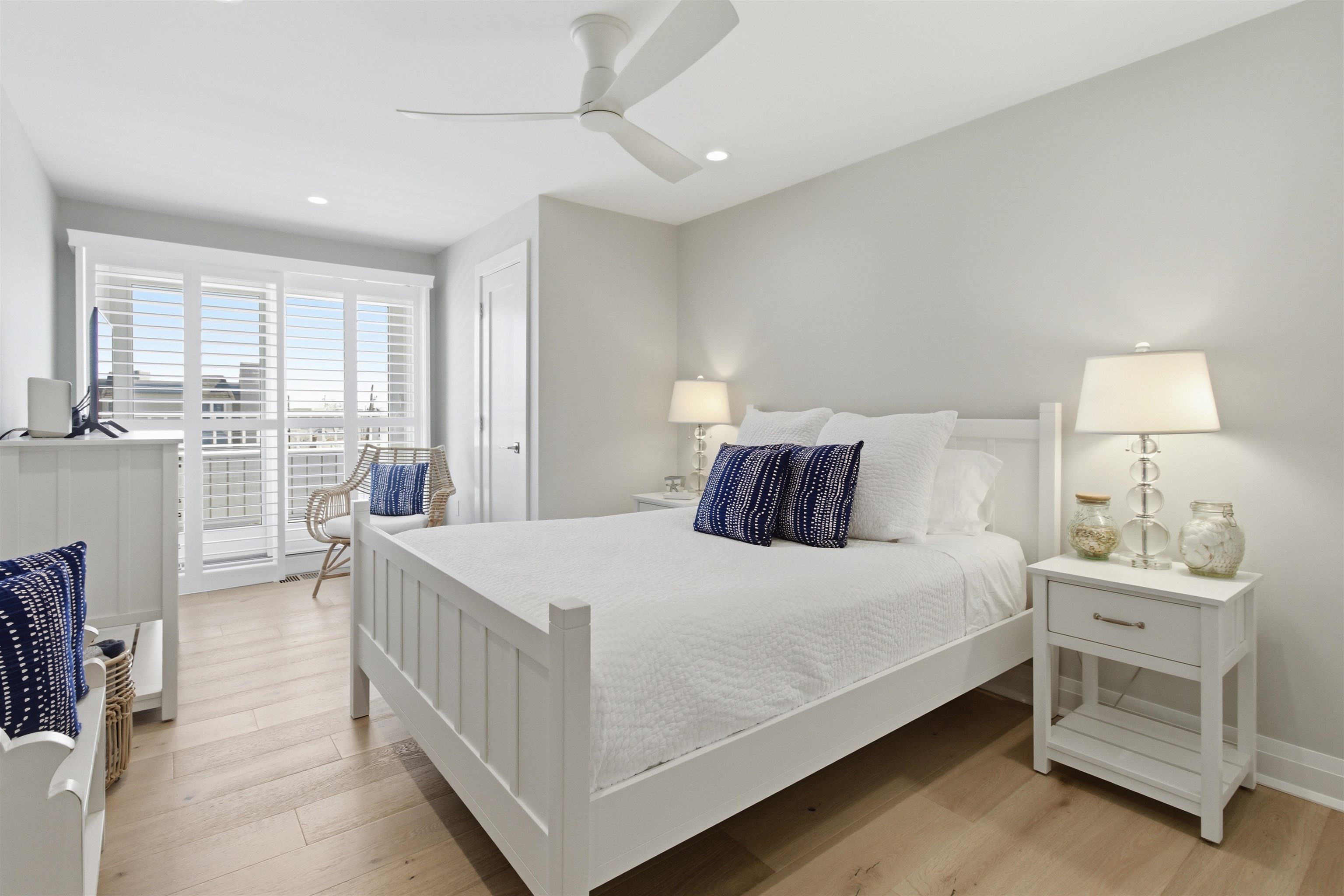 10803 3rd, Unit 6 Stone Harbor, NJ 08247 - Photo 20 of 25 a bedroom with a bed and a window