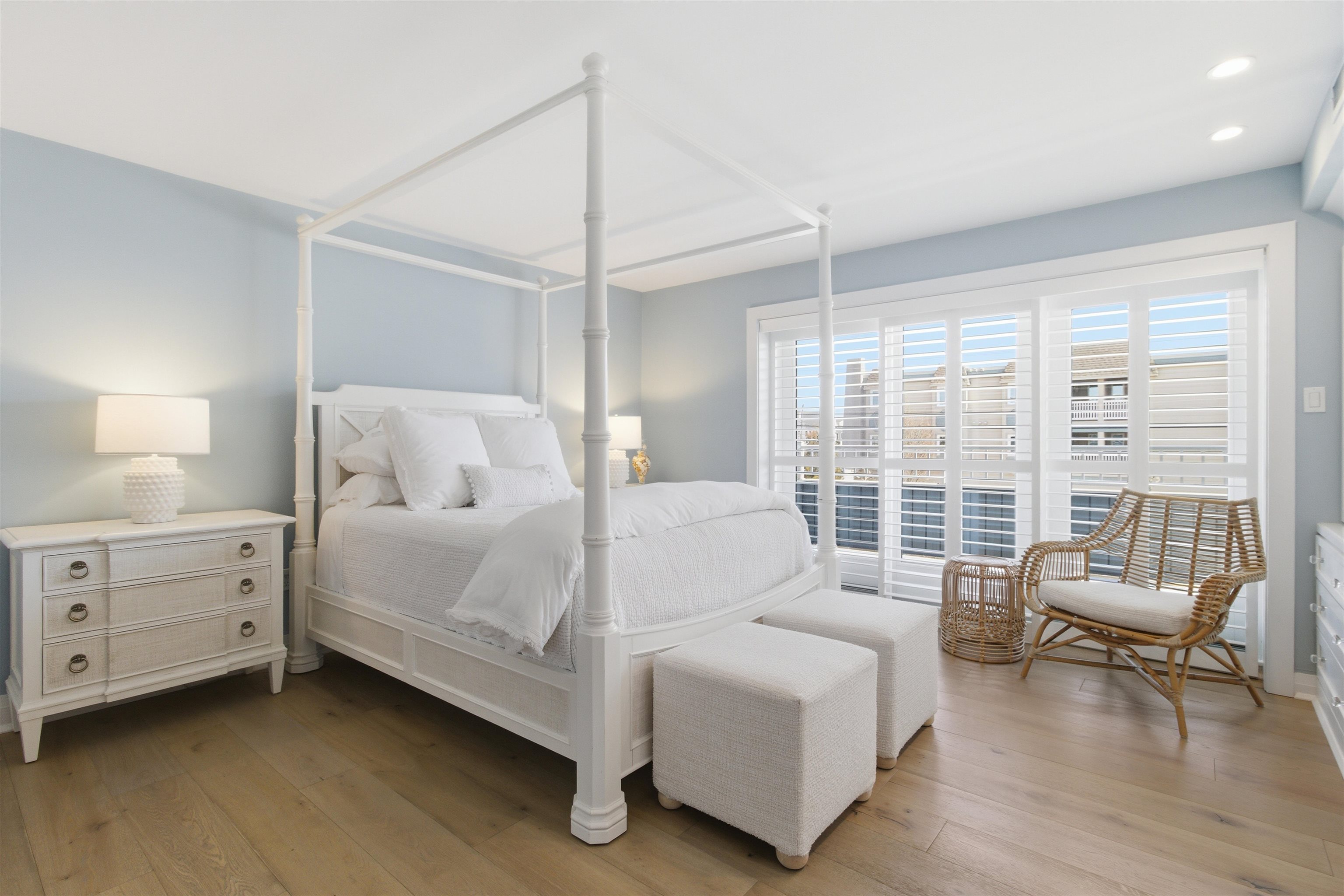 10803 3rd, Unit 6 Stone Harbor, NJ 08247 - Photo 5 of 25 a room with a bed and a chair