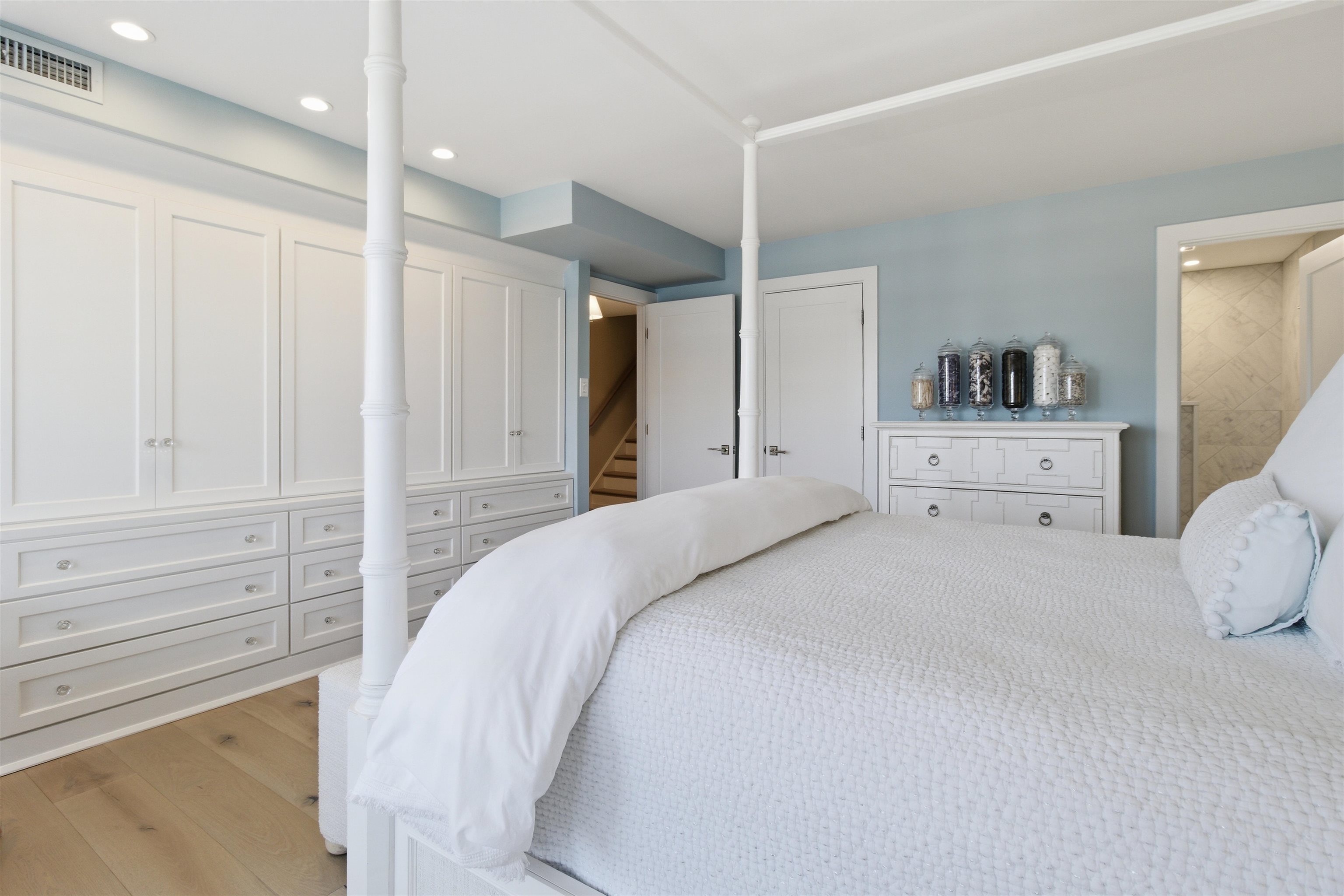 10803 3rd, Unit 6 Stone Harbor, NJ 08247 - Photo 7 of 25 a bedroom with a large bed and a large window