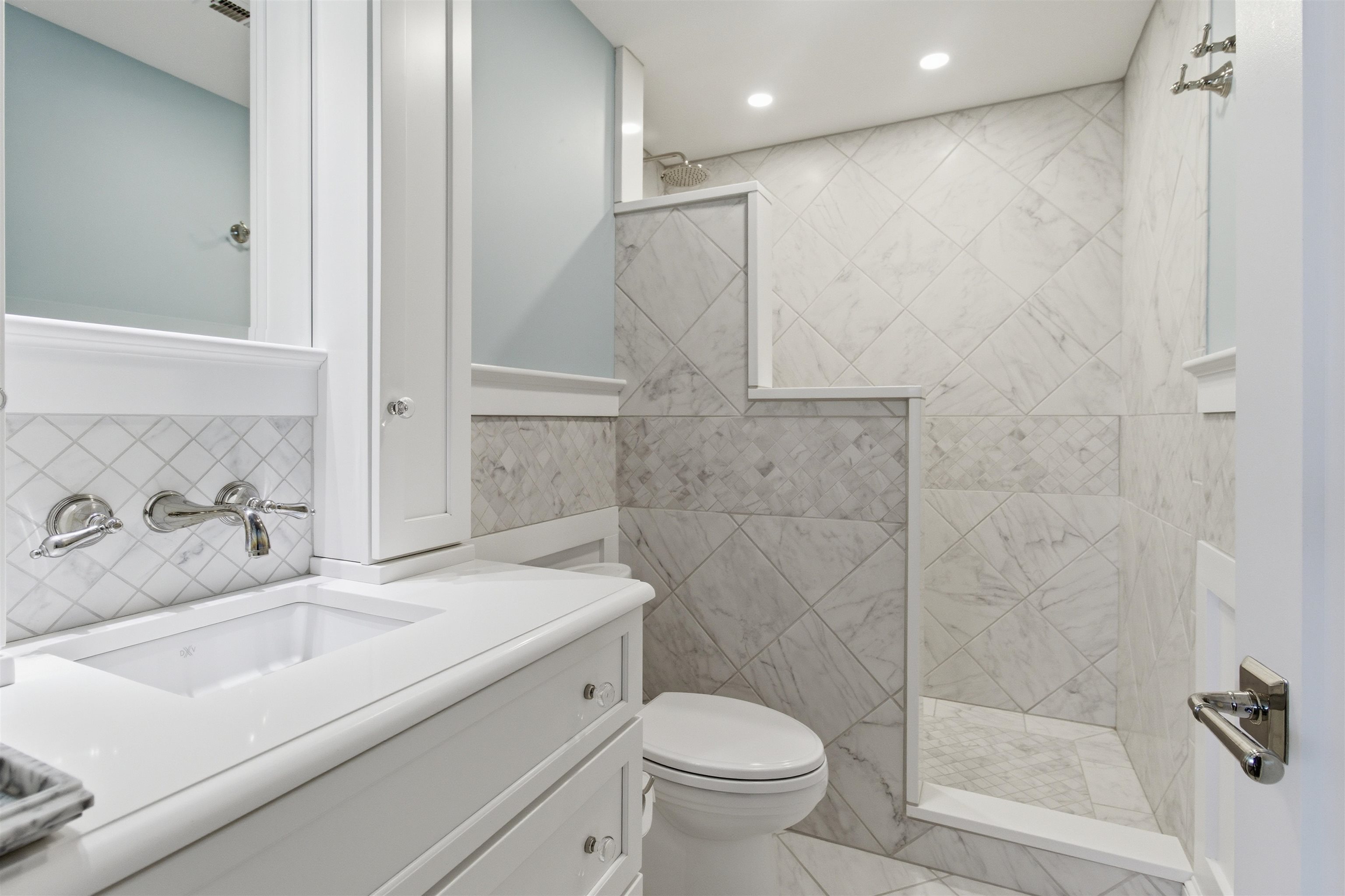 10803 3rd, Unit 6 Stone Harbor, NJ 08247 - Photo 8 of 25 a bathroom with a sink toilet and shower