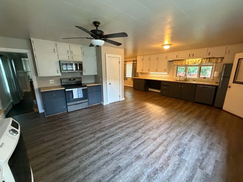 280 State Road North Adams, MA 01247 - Photo 7 of 35 a view of a kitchen with cabinets and wooden floor