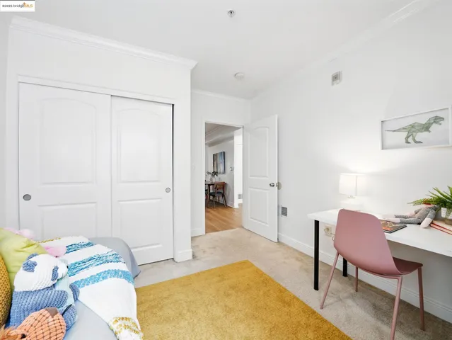 a bedroom with bed and a window