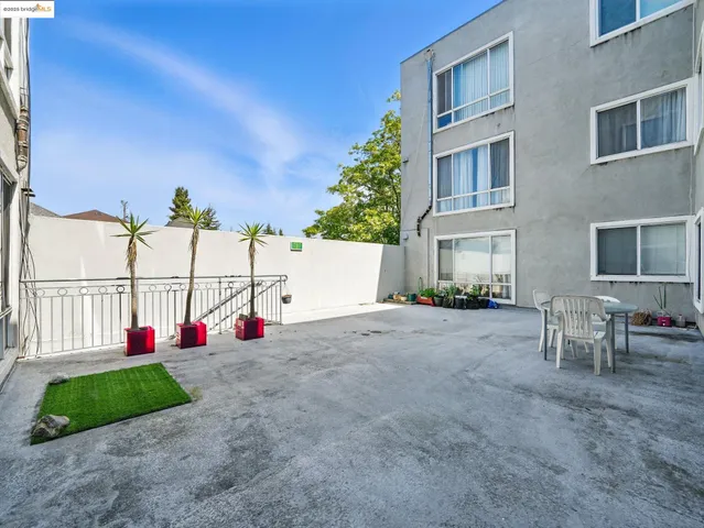 a view of a house with entertaining space and a park