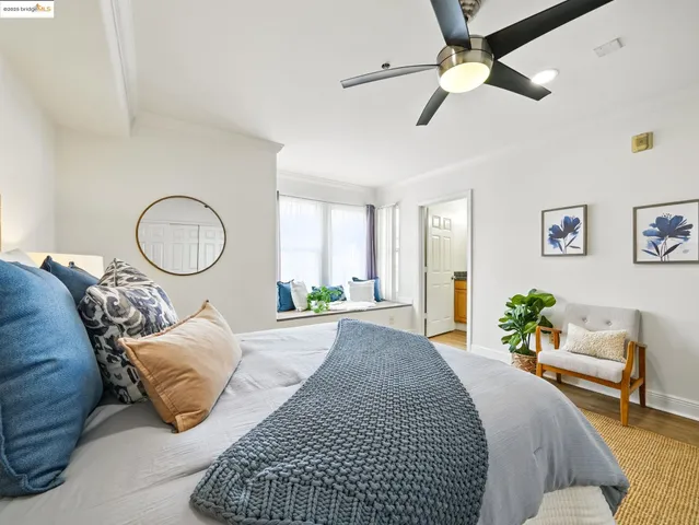 a bed room with a bed and a chandelier