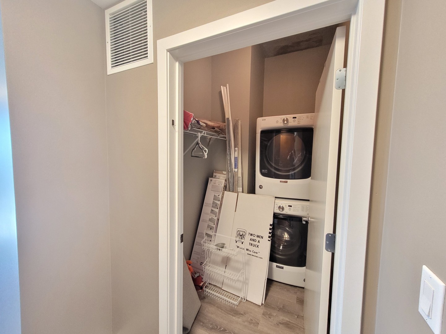 235 West Van Buren Street, Unit 4413 Chicago, IL 60607 - Photo 17 of 23 a utility room with a washer and dryer