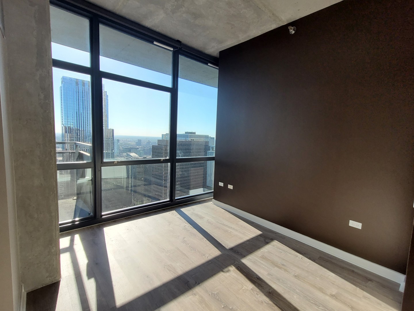 235 West Van Buren Street, Unit 4413 Chicago, IL 60607 - Photo 9 of 23 a view of an empty room and window