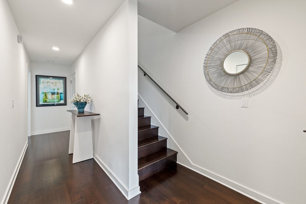2003 Wilson Street, Unit 3 Austin, TX 78704 - Photo 21 of 27 a view of a hallway with wooden floor and staircase