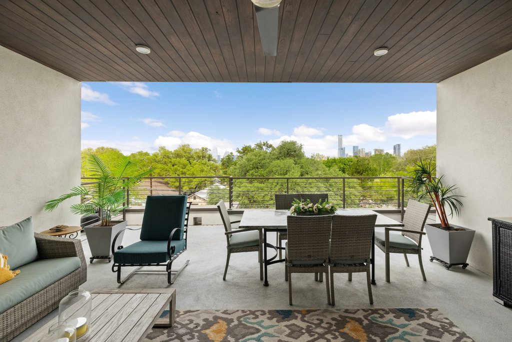 2003 Wilson Street, Unit 3 Austin, TX 78704 - Photo 22 of 27 a balcony with furniture and a potted plant