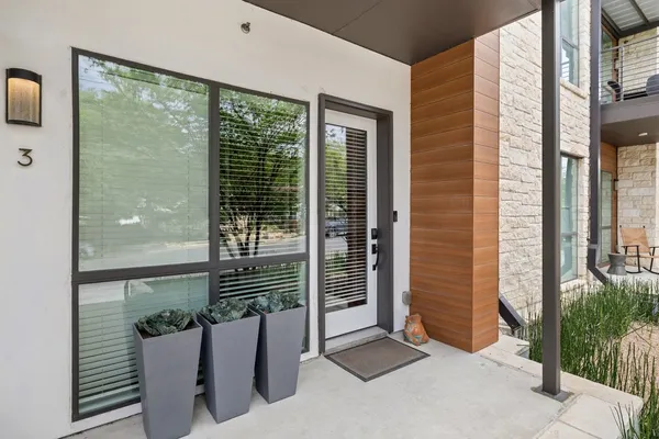 a view of potted plant in front of a door