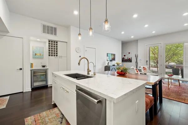 a open kitchen with stainless steel appliances kitchen island a large island in the center