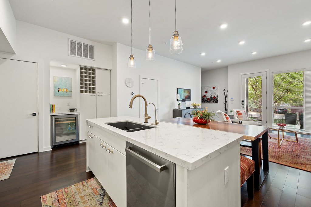 2003 Wilson Street, Unit 3 Austin, TX 78704 - Photo 8 of 27 a open kitchen with stainless steel appliances kitchen island a large island in the center