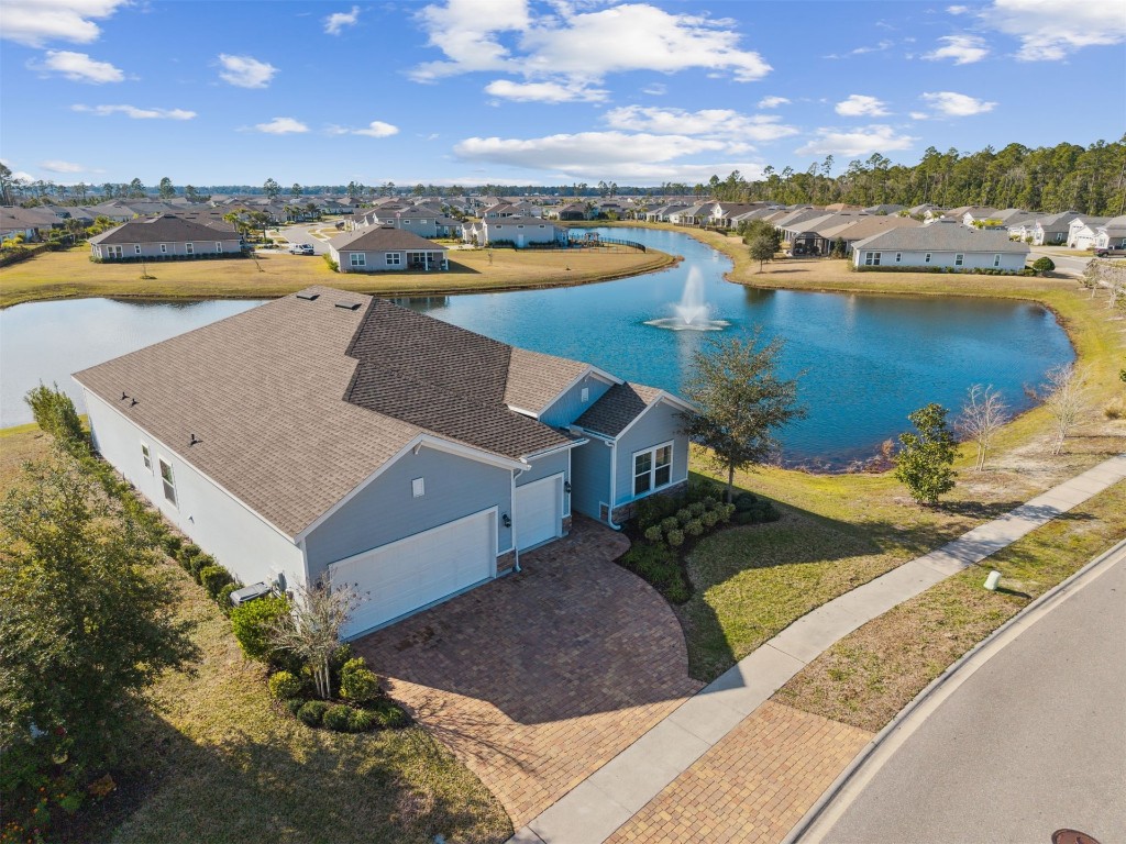 an aerial view of a house with lake view