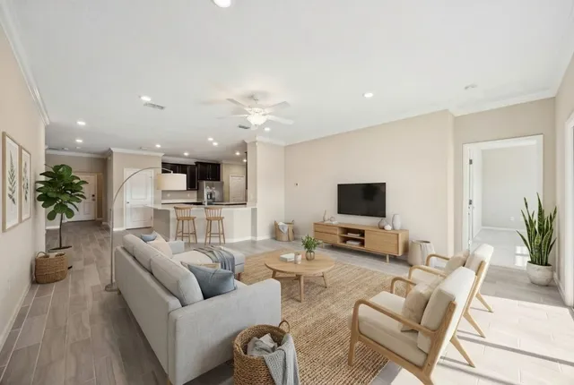 a bedroom with a large bed couch and a window