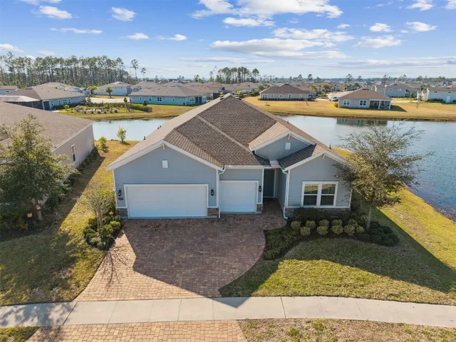 a view of a lake with boats and trees in the background