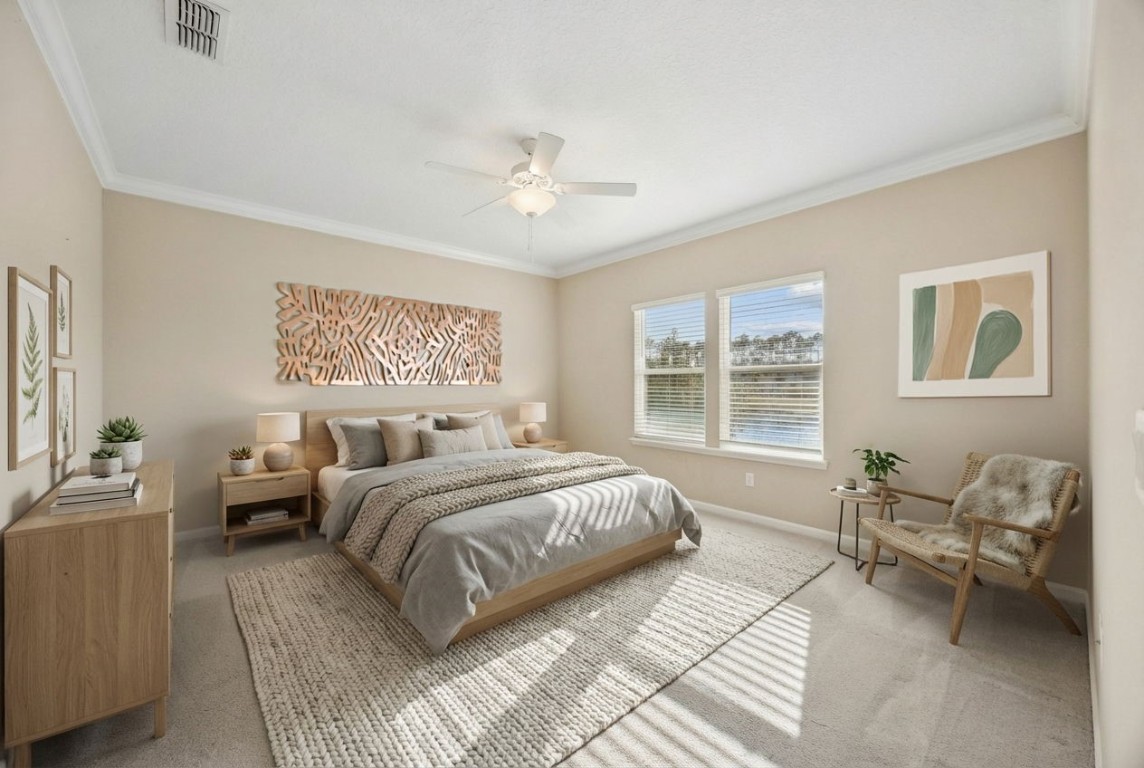 85237 Fall River Parkway Fernandina Beach, FL 32034 - Photo 5 of 82 a bedroom with a large bed couch and a window