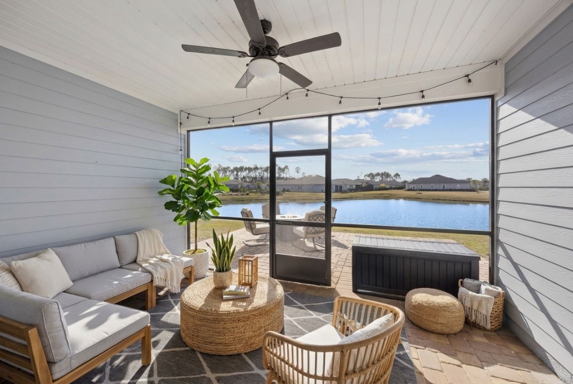 85237 Fall River Parkway Fernandina Beach, FL 32034 - Photo 6 of 82 a living room with furniture and a floor to ceiling window