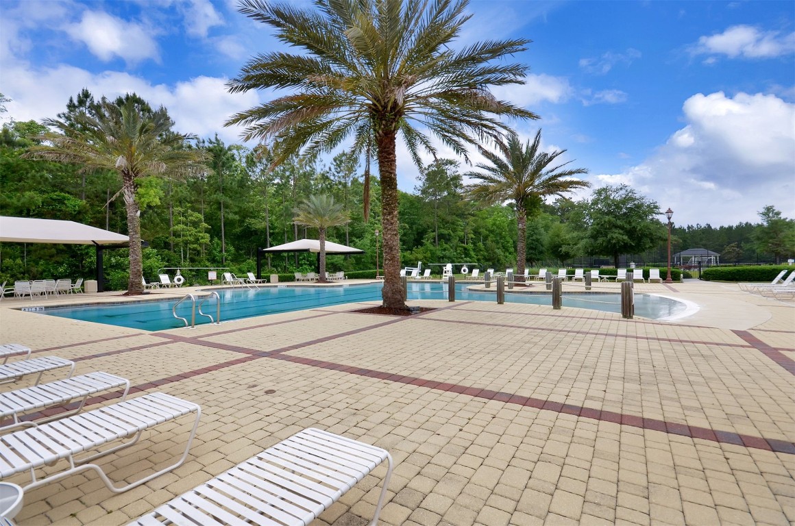 85237 Fall River Parkway Fernandina Beach, FL 32034 - Photo 65 of 82 a view of a yard with a slide
