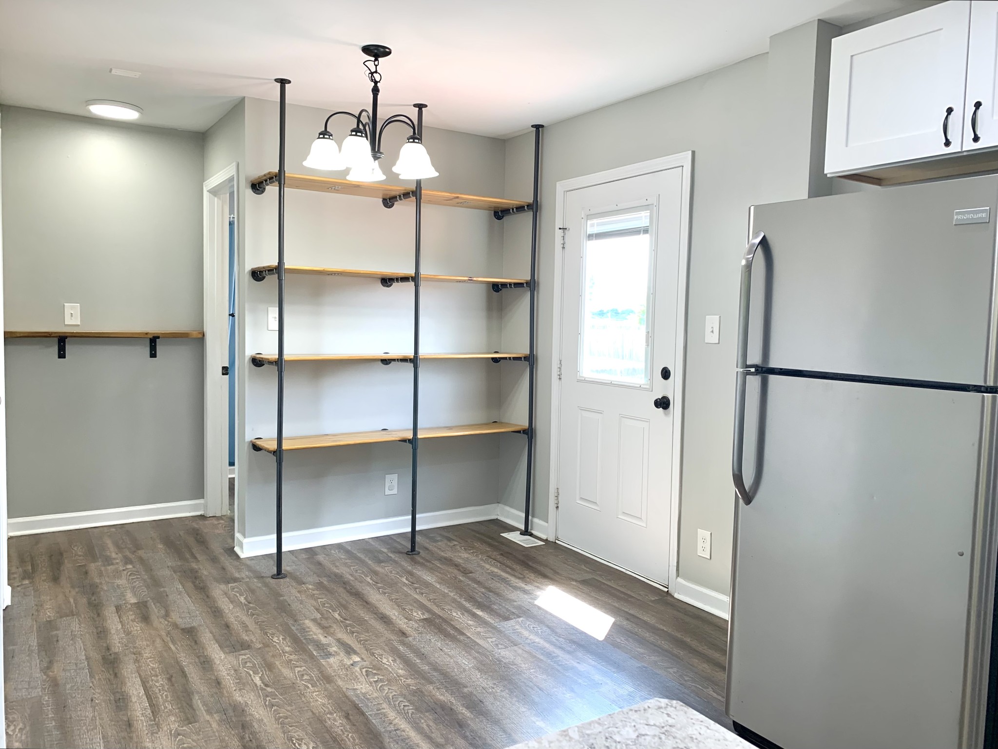 819 Stableford Road Oak Grove, KY 42262 - Photo 16 of 50 a view of a kitchen with a refrigerator and wooden floor