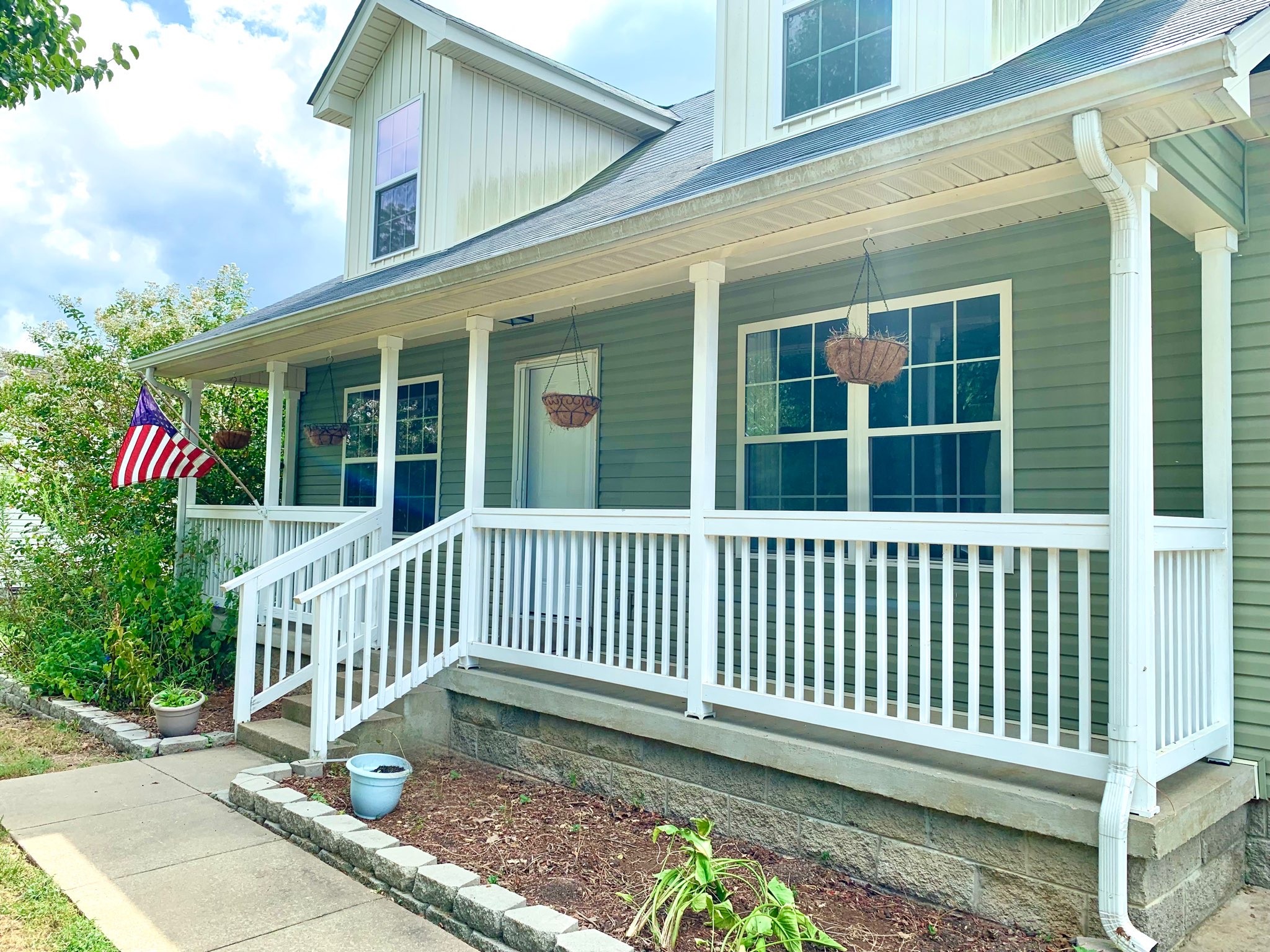 819 Stableford Road Oak Grove, KY 42262 - Photo 3 of 50 a porch with a bench next to a yard