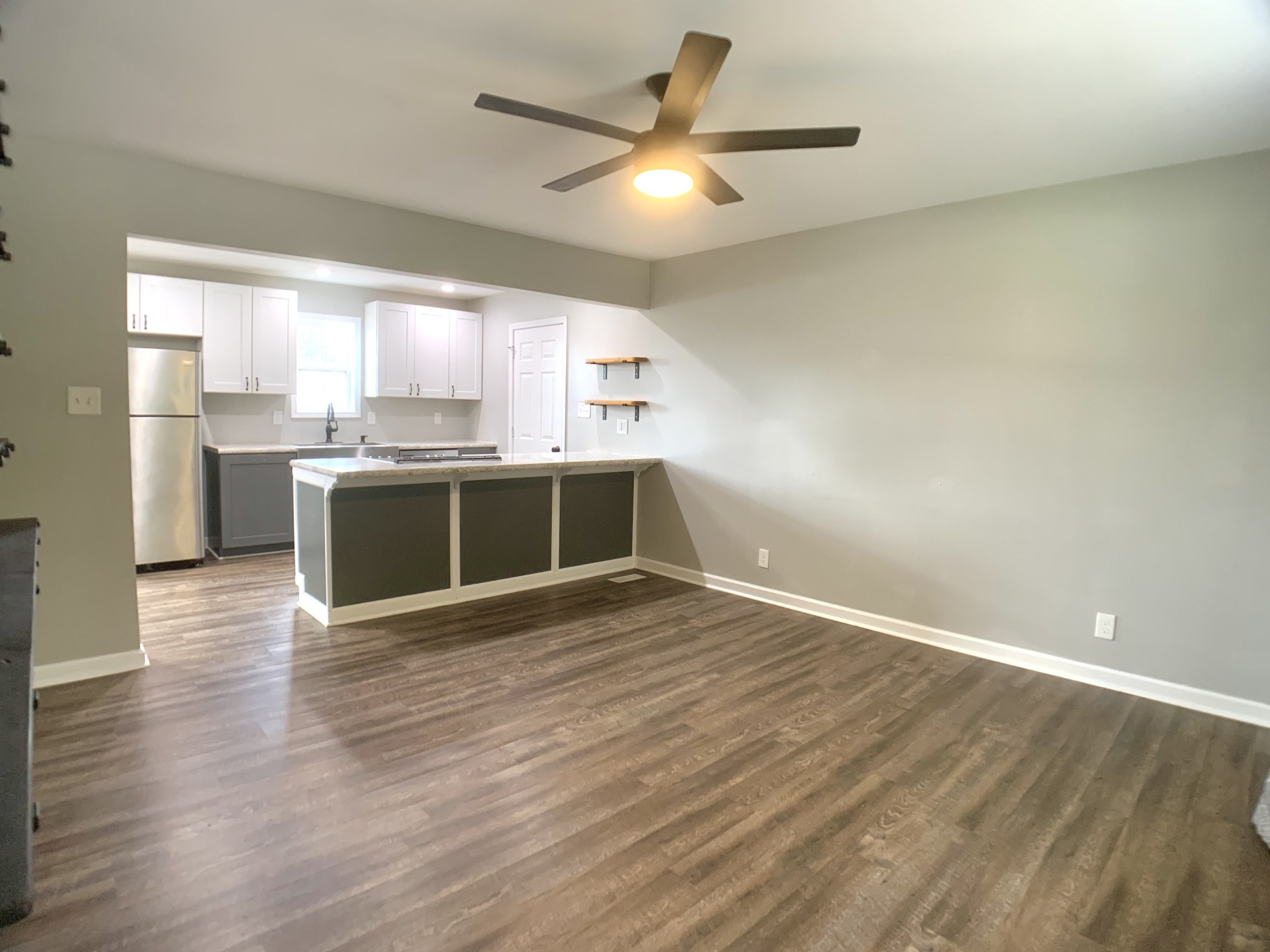 819 Stableford Road Oak Grove, KY 42262 - Photo 7 of 50 a view of a kitchen with a sink and wooden floor
