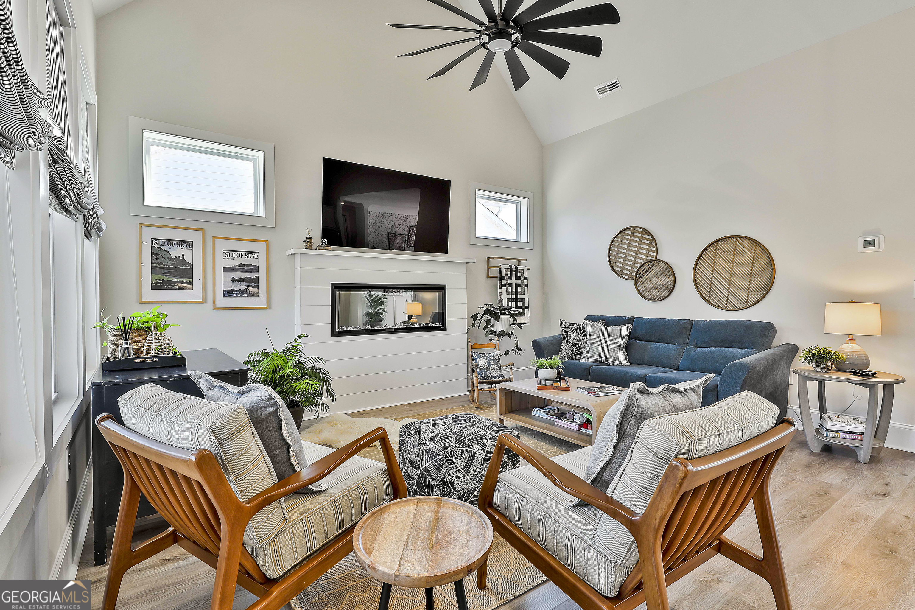 335 Werner Way Senoia, GA 30276 - Photo 24 of 51 a living room with furniture kitchen view and a flat screen tv