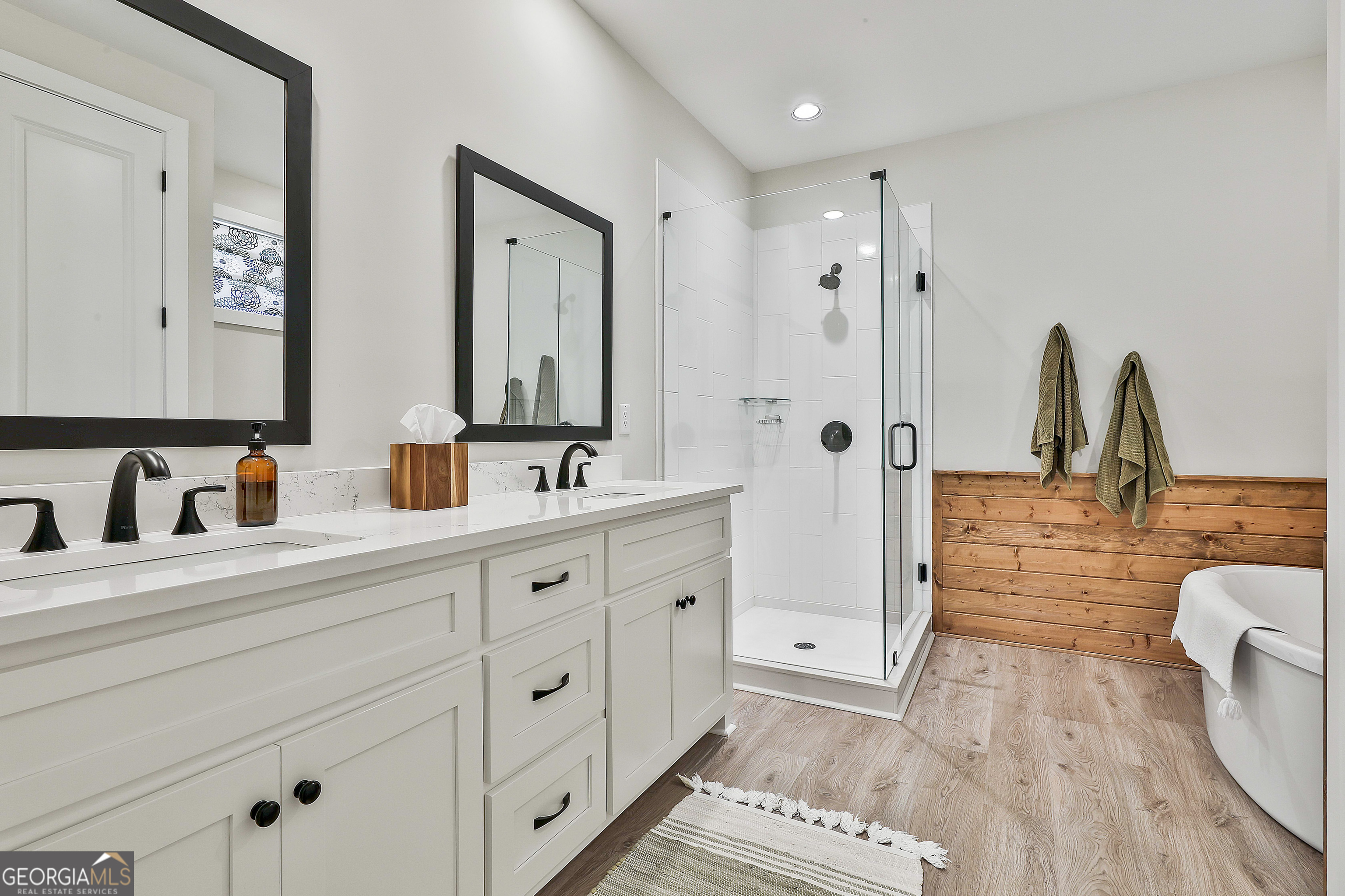 335 Werner Way Senoia, GA 30276 - Photo 32 of 51 a bathroom with double vanity sink and mirror