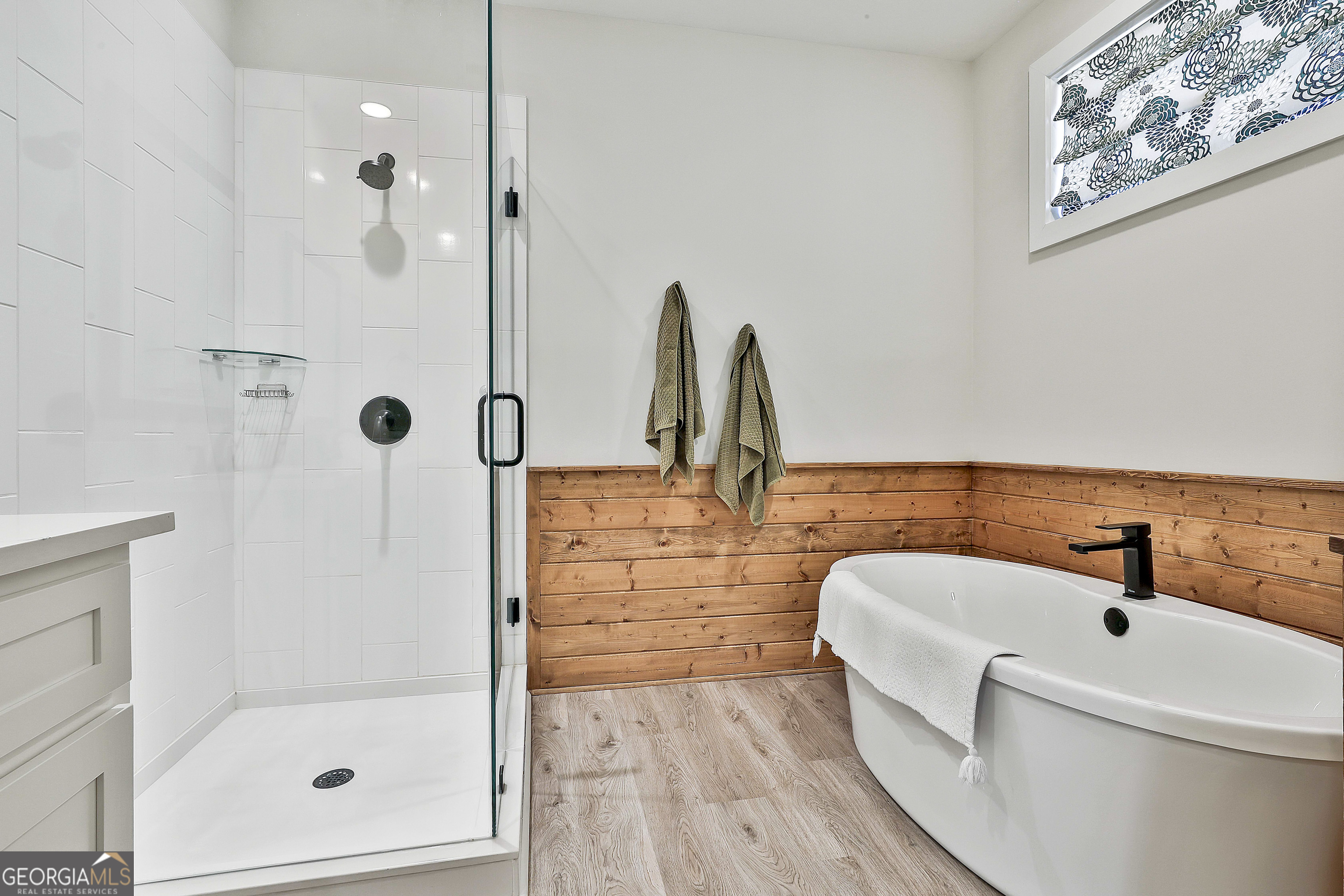 335 Werner Way Senoia, GA 30276 - Photo 33 of 51 a bathroom with a tub sink and mirror