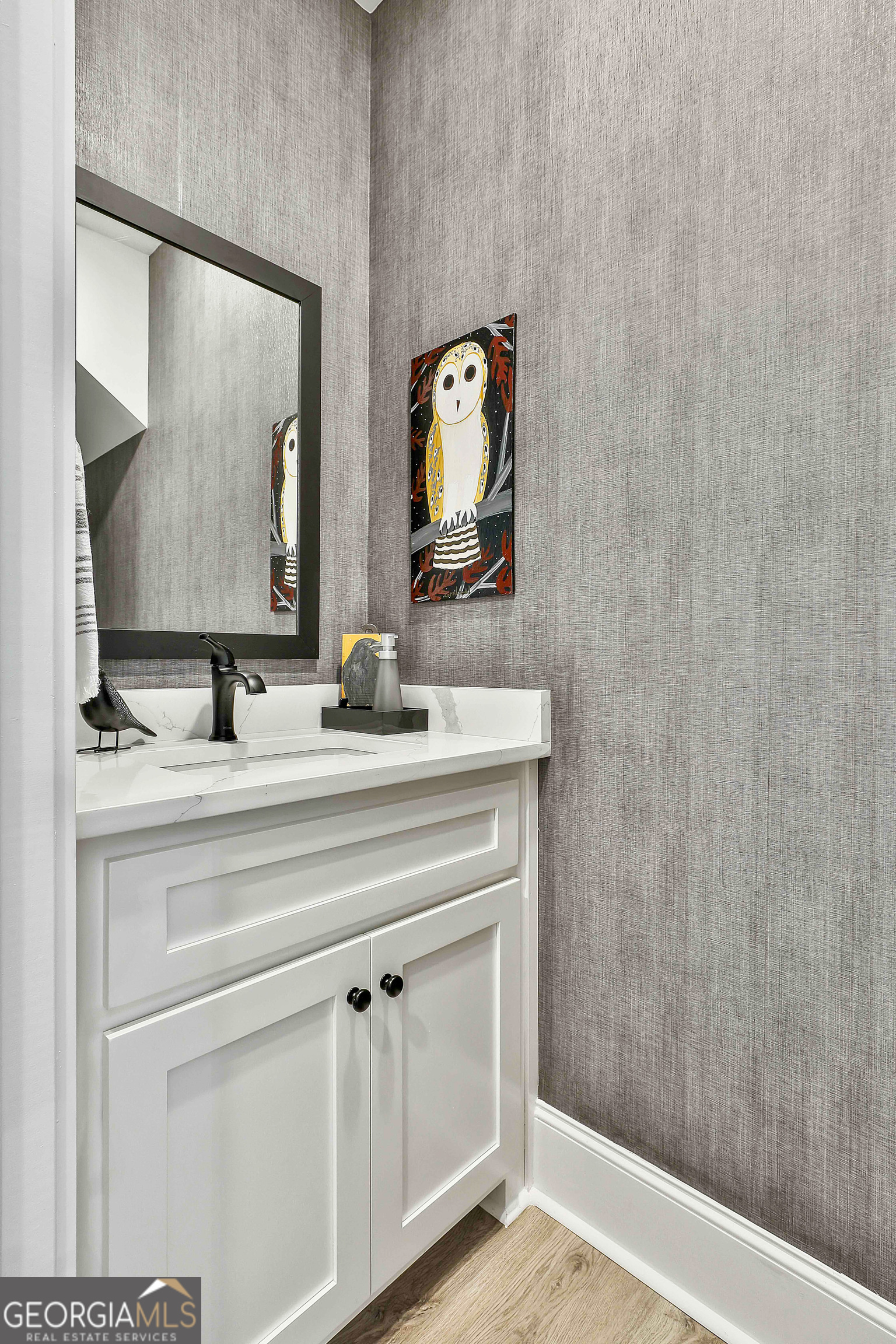 335 Werner Way Senoia, GA 30276 - Photo 38 of 51 a bathroom with a sink and a mirror