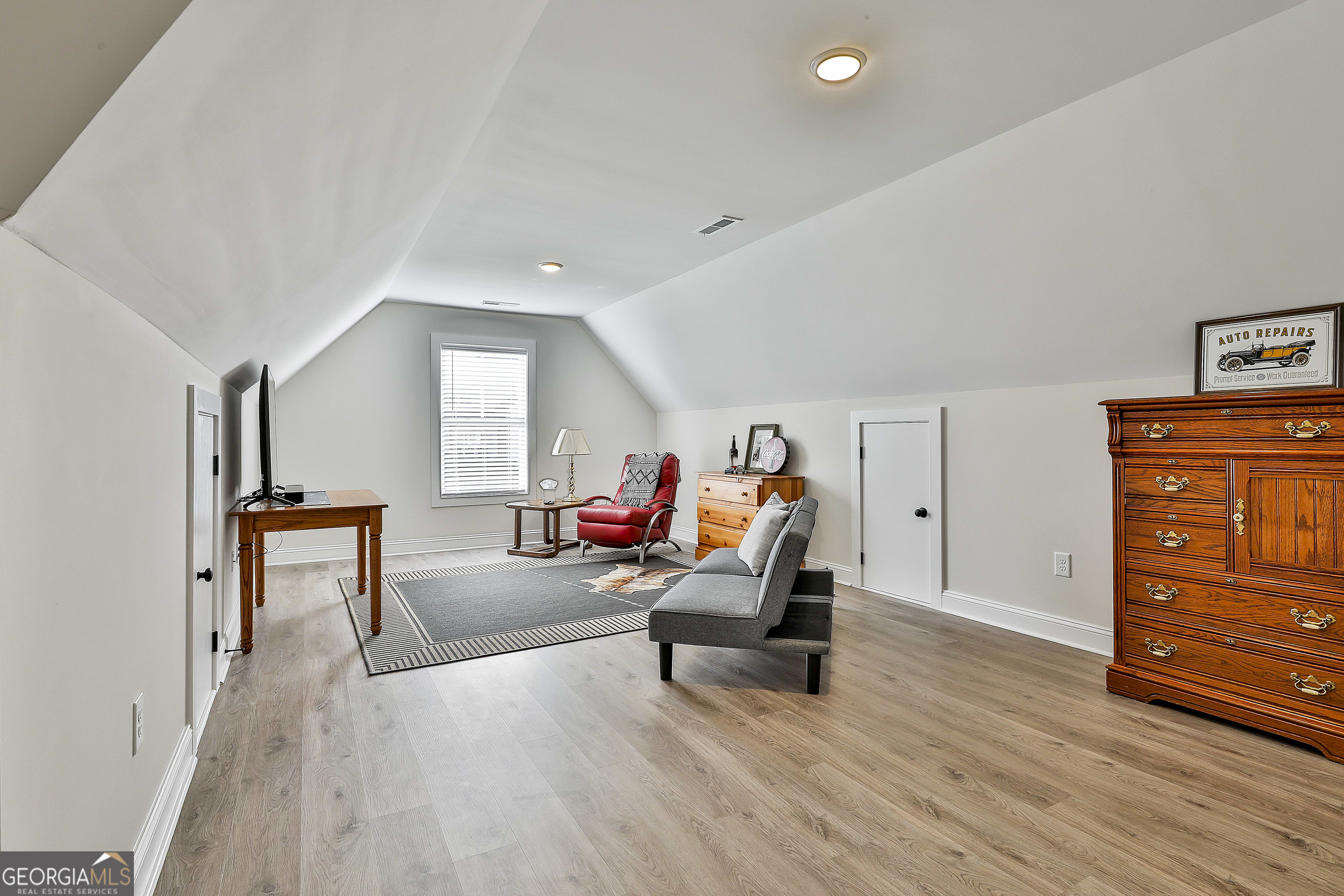 335 Werner Way Senoia, GA 30276 - Photo 42 of 51 a living room with furniture and a wooden floor