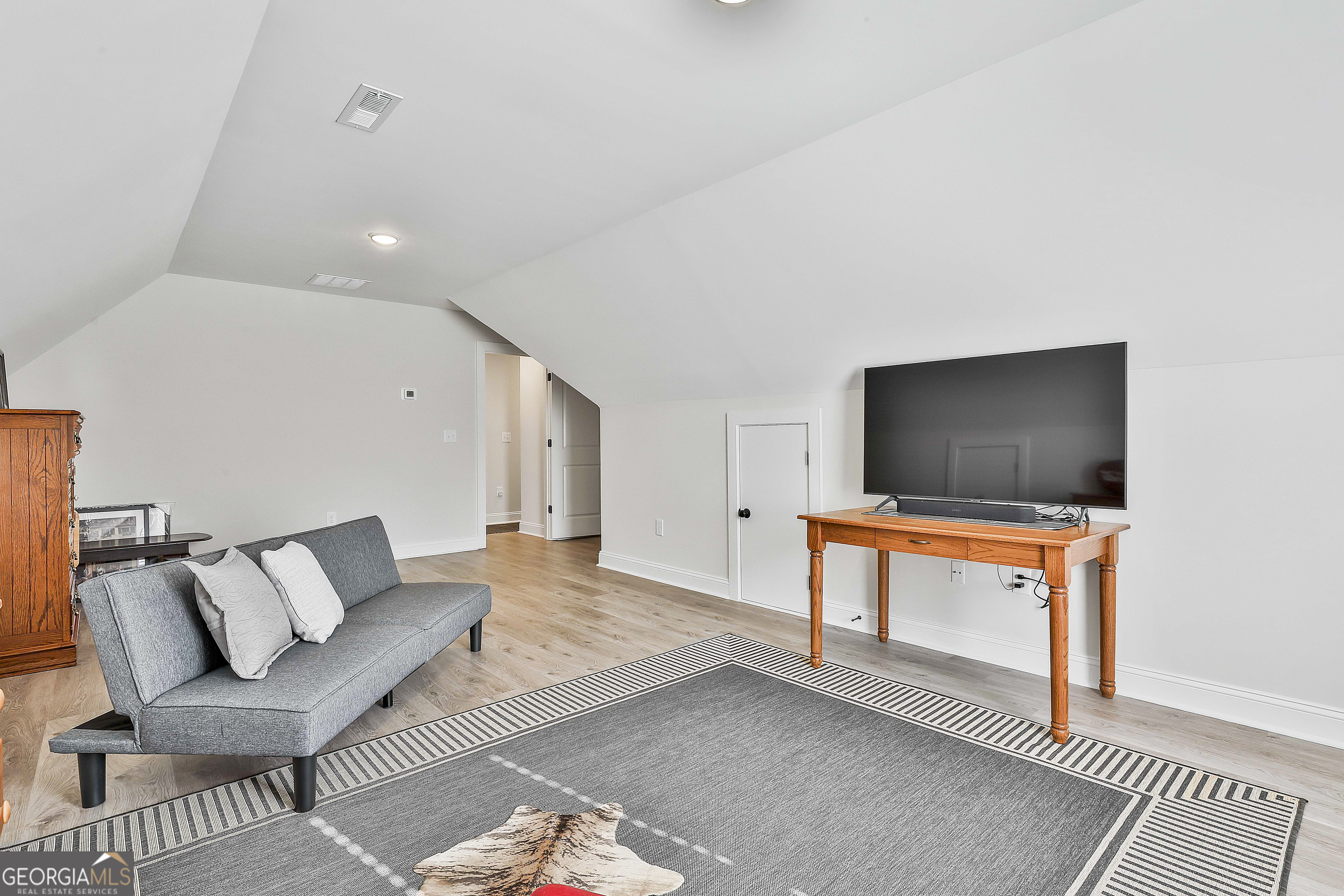 335 Werner Way Senoia, GA 30276 - Photo 43 of 51 a living room with furniture and a flat screen tv