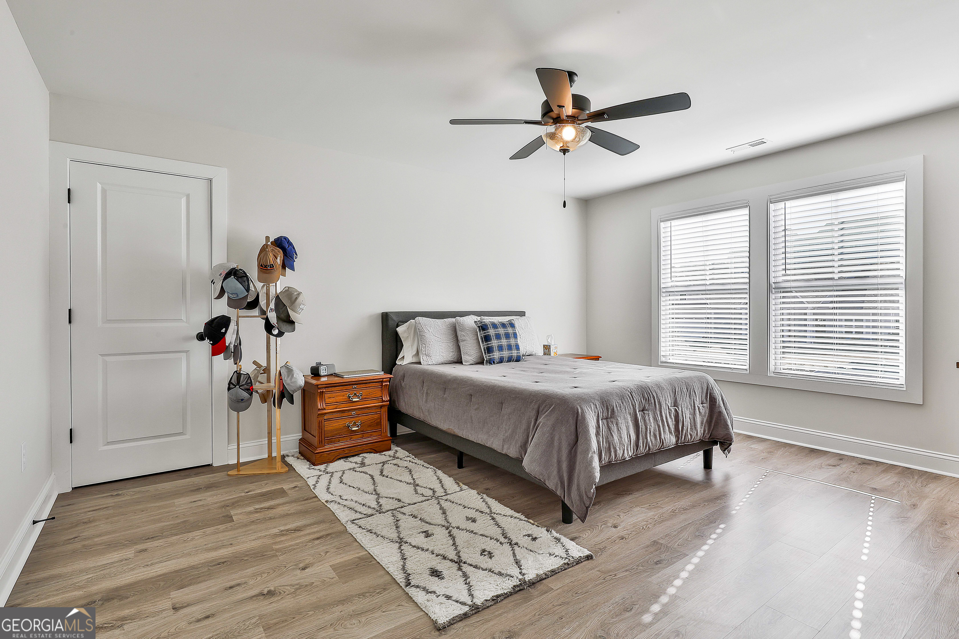 335 Werner Way Senoia, GA 30276 - Photo 45 of 51 a bedroom with a bed and a chandelier