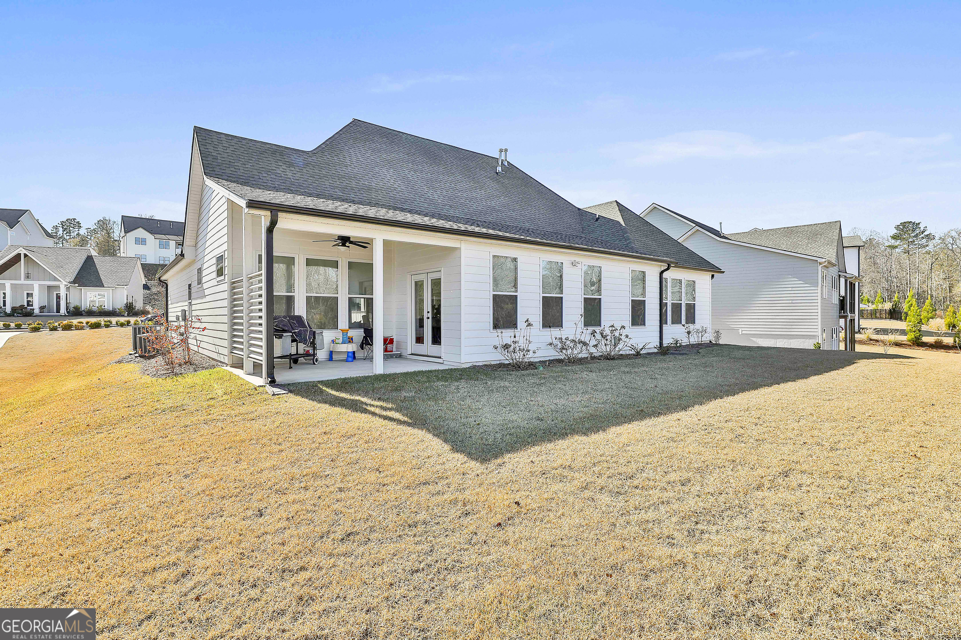 335 Werner Way Senoia, GA 30276 - Photo 49 of 51 a view of a white house with swimming pool in front of it