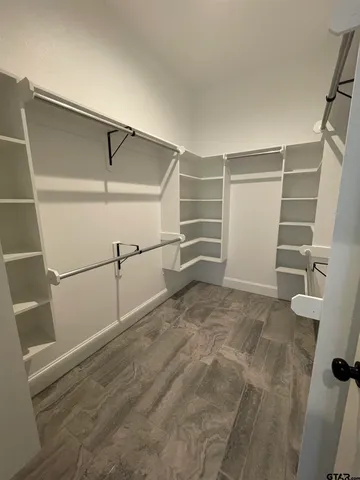 a view of green field with fence