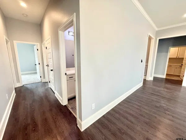 a bathroom with a double vanity sink mirror and toilet