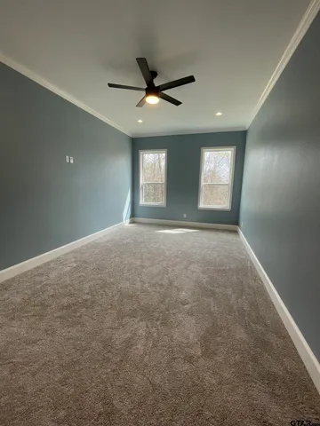 a bathroom with a granite countertop double vanity sink and a mirror