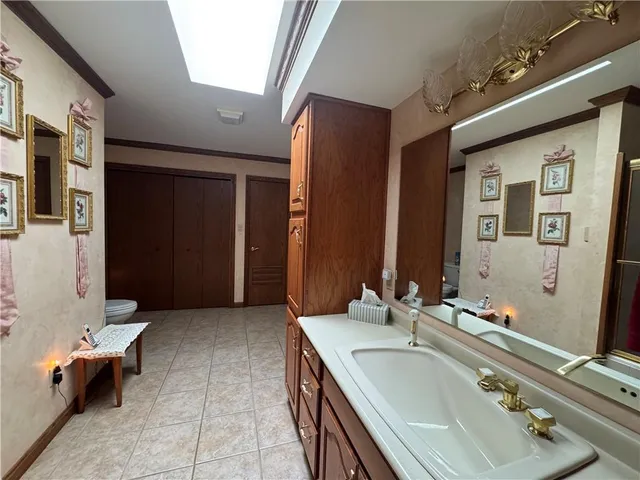 a bathroom with a tub sink and mirror