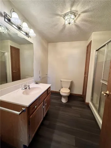 a utility room with refrigerator and washer