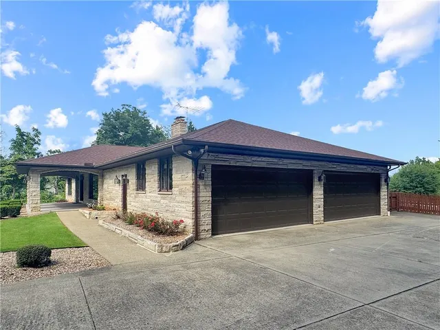 a front view of a house with yard
