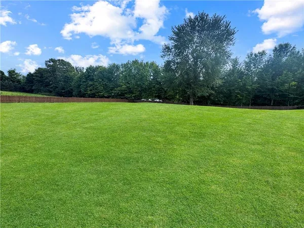 a view of outdoor space with deck and green space