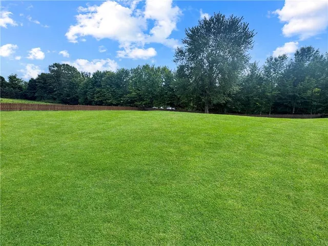a view of outdoor space with deck and green space