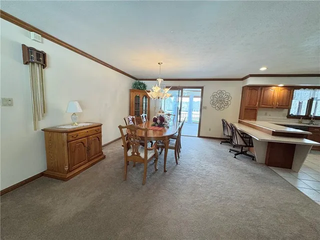 a kitchen with stainless steel appliances kitchen island granite countertop a sink and cabinets