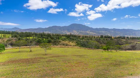 a view of an ocean and a mountain