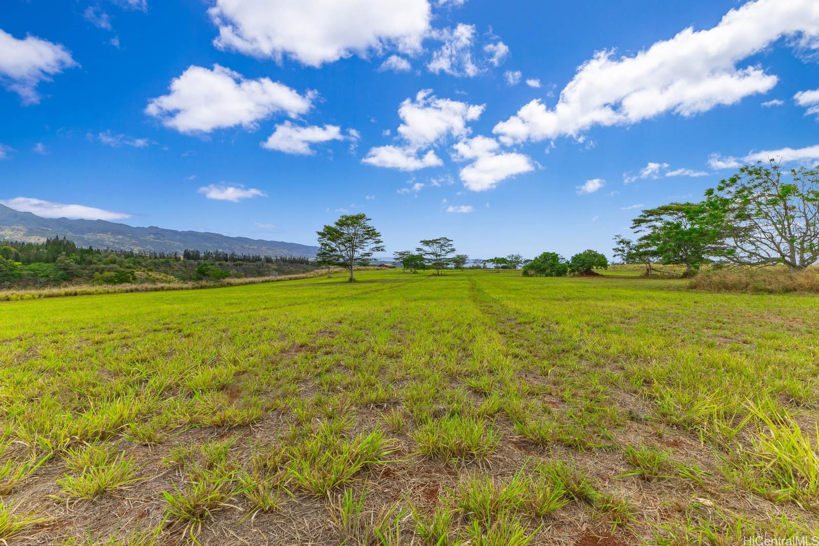 64-486 Kamehameha Highway, Unit 34F Haleiwa, HI 96712 - Photo 9 of 25 a view of a golf course with swimming pool